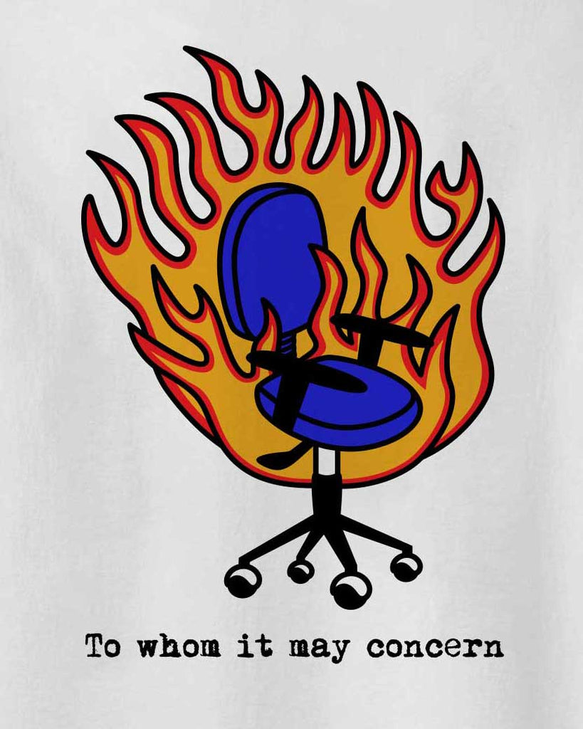 The back of Fire Chair tshirt in Aponia Store with the graphic of a chair burning on fire on the back and the text: "To whom it may concern"